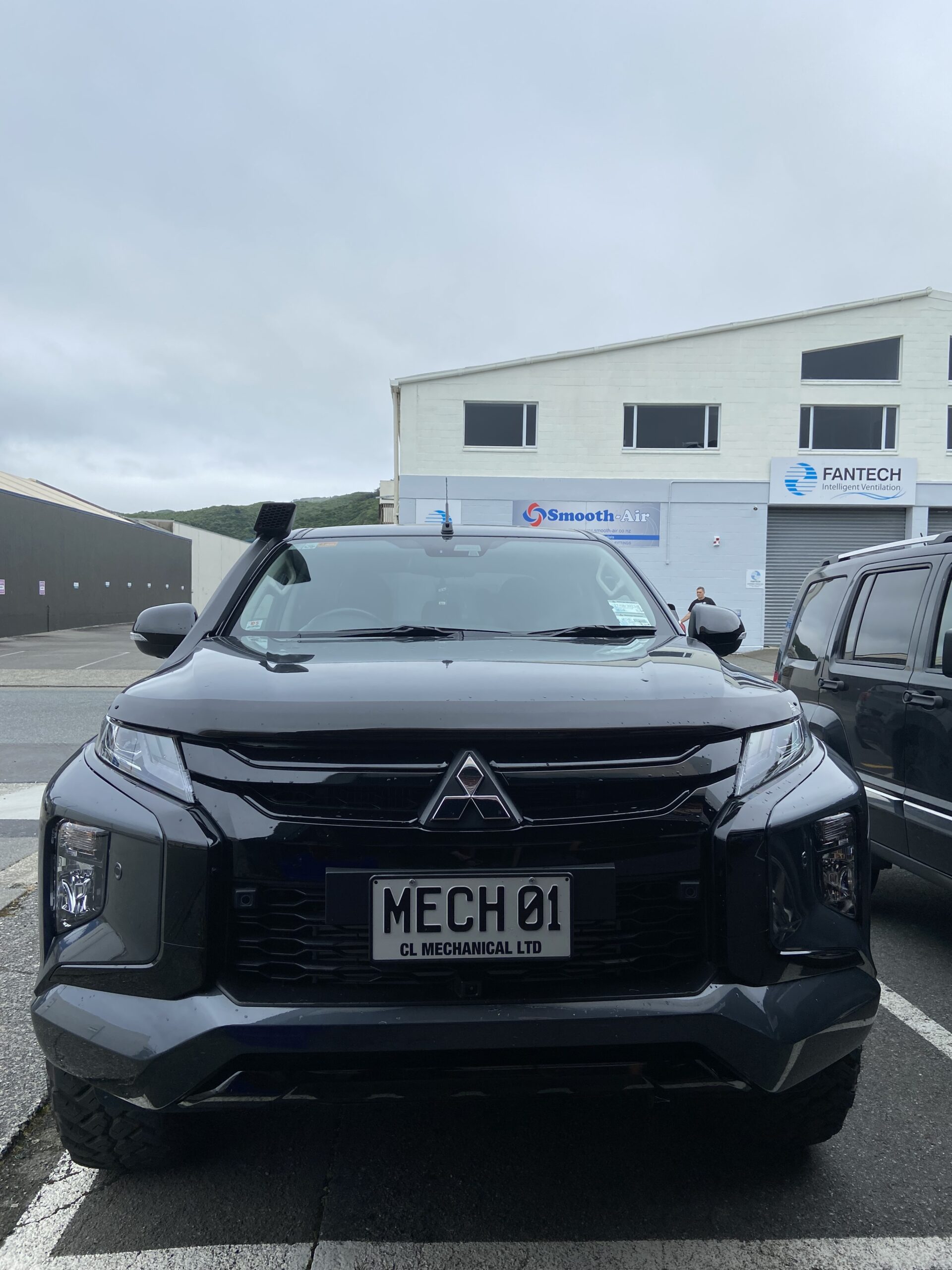 front view of black company ute